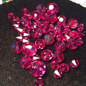 Various shapes and sizes of pink crystals
